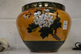 A Royal Doulton jardiniere.