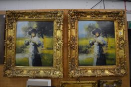 A pair of large decorative gilt framed prints.