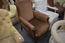 A Victorian walnut framed armchair.