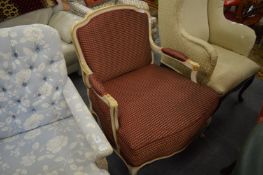 A French style open armchair with painted and parcel gilded frame.