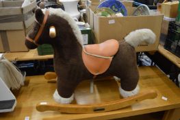 A Mamas & Papas rocking horse.