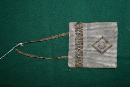 A bead work evening purse.