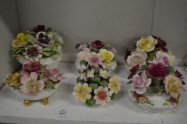 A group of six Aynsley and other porcelain flower groups.