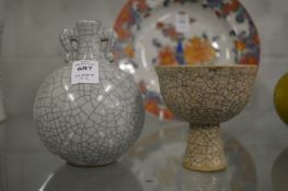 A Chinese crackle glazed twin handled vase and a similar pedestal cup.