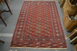 A Bokhara rug, worn 190cm x 130cm.