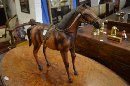 A leather model of a horse.