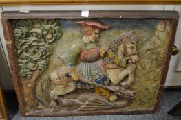 A carved wood and polychrome decorated panel of George slaying the Dragon.