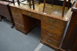 A Victorian pitch pine pedestal desk.