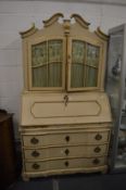 A Continental painted pine bureau bookcase.