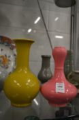 A Chinese garlic head pink glazed vase and another vase.