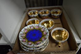 A set of six lustre decorated cups and saucers.