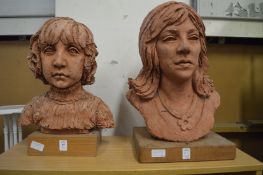 Two large terracotta busts.