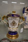 An Aynsley limited edition porcelain twin handled loving cup and cover made to commemorate the