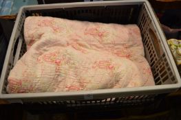 A quilted bedspread.