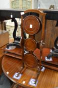 A mahogany folding cake stand.