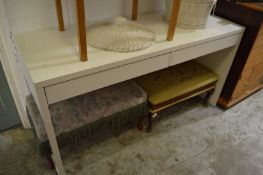 A modern two drawer side table or desk.