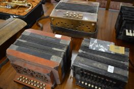 Three various accordions.