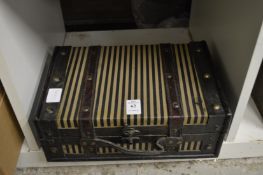 A small suitcase style box.