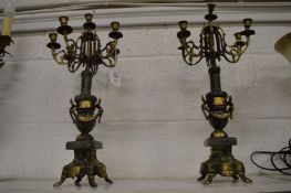 A pair of onyx and ormolu candelabra.