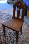 A Victorian walnut hall chair.