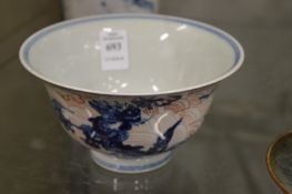 A Chinese blue, white and red glazed bowl painted with a dragon.
