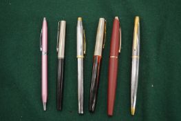 A group of Cross and other pens.