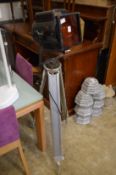 An old spotlight on tripod stand.