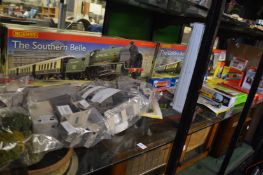 Quantity of boxed railways and railway accessories.