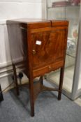 A mahogany washstand with bi-fold top.