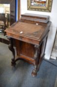 A Victorian walnut Davenport.