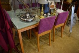Stylish beech framed and glass extending dining table with six chairs.