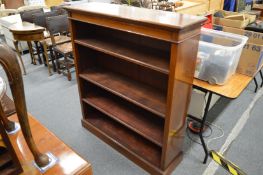 A mahogany and satin wood banded open bookcase.