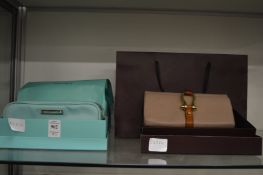 Tiffany & Co, a boxed makeup bag together with a boxed Mulberry purse.