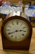 An Edwardian mahogany cased mantel clock, the dial signed Edward & Sons.