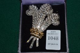 A decorative Prince of Wales feathers shaped brooch.