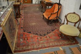 An early 20th century Persian hall carpet with Boteh decoration (worn), 500cm x 205cm.
