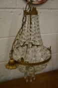 An ormolu and cut glass chandelier.