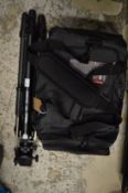 Camera tripod and a holdall.