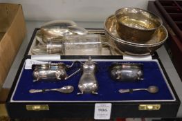 A cased silver condiment set and other items of silver.