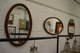 Three oval wall mirrors.