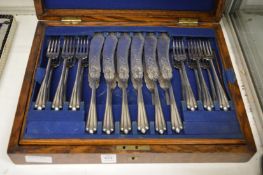A cased set of twelve plated fish knives and forks.