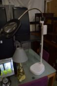 A floor standing illuminated magnifier.