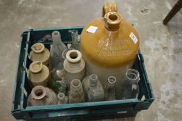 Stoneware flagon and old bottles.