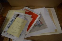 A collection of unframed prints.