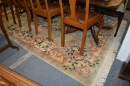 A beige ground Chinese carpet, 270cm x 181cm.