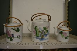 Three large Japanese teapots.