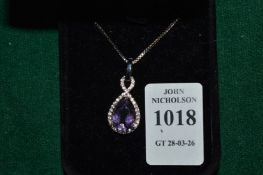 An amethyst pear shaped pendant and chain.