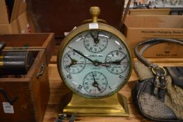 A giant brass ball clock.