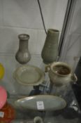 A collection of five items of Chinese celadon glazed pottery.