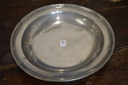 A pewter circular dish.